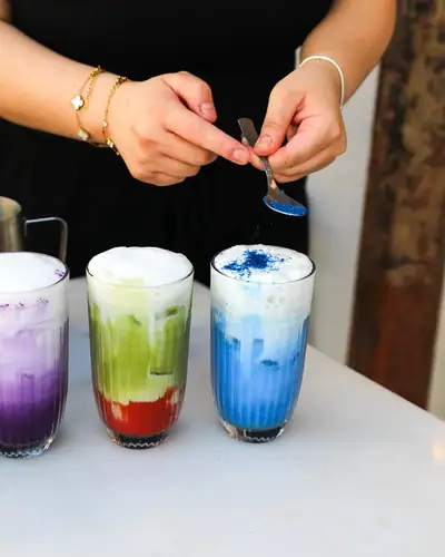 Colourful lattes being made at the Oma Beaurepaire counter