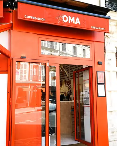 The orange façade of Oma Beaurepaire at 6 rue Beaurepaire, Paris 10