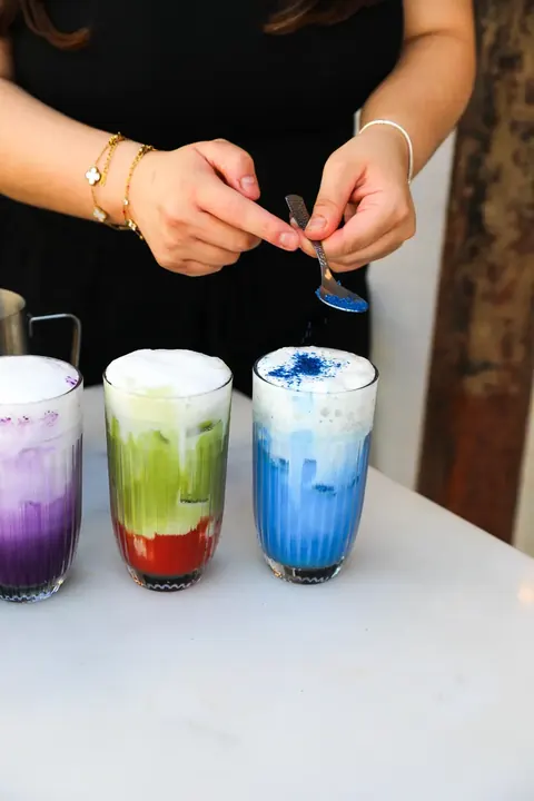 Colourful lattes being made at the Oma Beaurepaire counter
